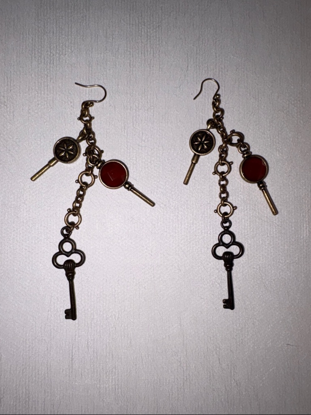 Lucky Brand Bronze Key Dangle Earrings with Red Accents